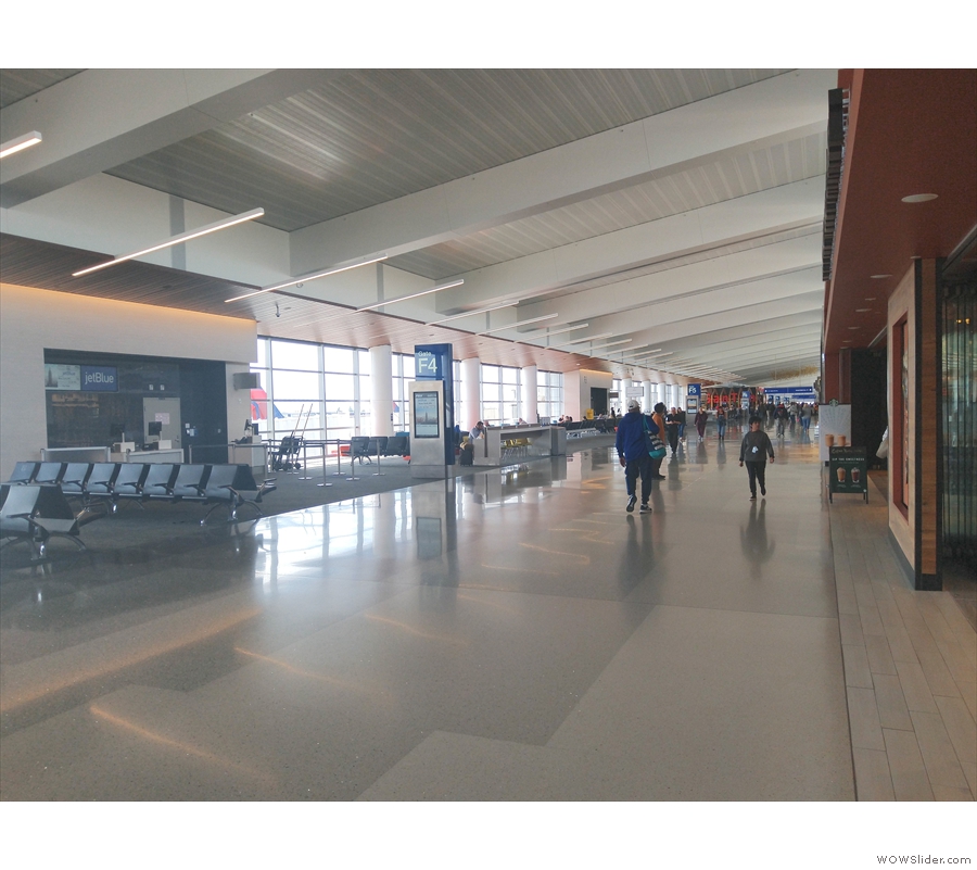 The terminal itself is this long, wide, bright corridor, with gates on one side...