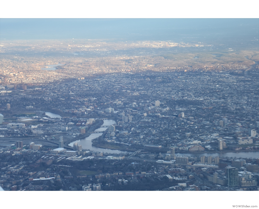 The Charles River turns north. Somewhere, down there, is Harvard Yard.