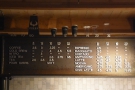 The coffee menu, and drink sizes, are on a girder above the counter.