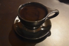 Here's my Guatemala del Florida filter in a black cup on a black saucer on a black table.