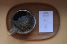... served in a glass Kinto cup, presented on a wooden tray, complete with tasting notes.
