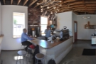A panoramic view of the coffee bar from the far corner. You can sit at the counter...
