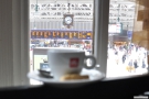 My (blurry) espresso, keeping a sharp eye on the trains for me!