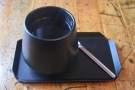 Our coffee, served on a metal tray in a gorgeous handleless cup.