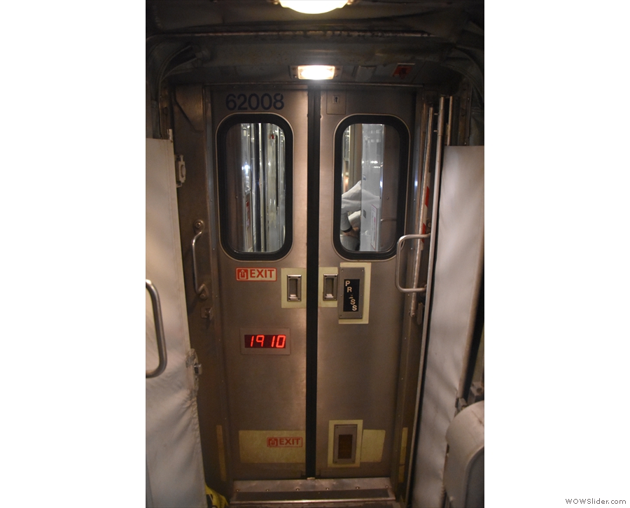 Each carriage is separated by a pair of sliding doors. Check out the foot-level push panel.