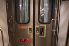 Each carriage is separated by a pair of sliding doors. Check out the foot-level push panel.