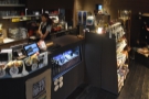 The counter runs all the way across the back of the room, with a large retail section...