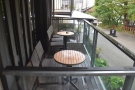 ... which lead out onto the enclosed terrace we saw from outside. There are two tables...