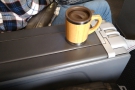 The seats have a wide armrest between them. That's my Global WAKECup, with the...