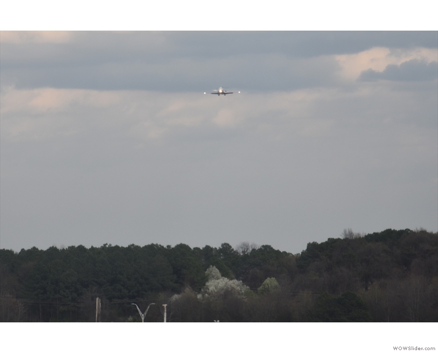 ... as, in the distance, another plane comes in to land on the parallel runway.