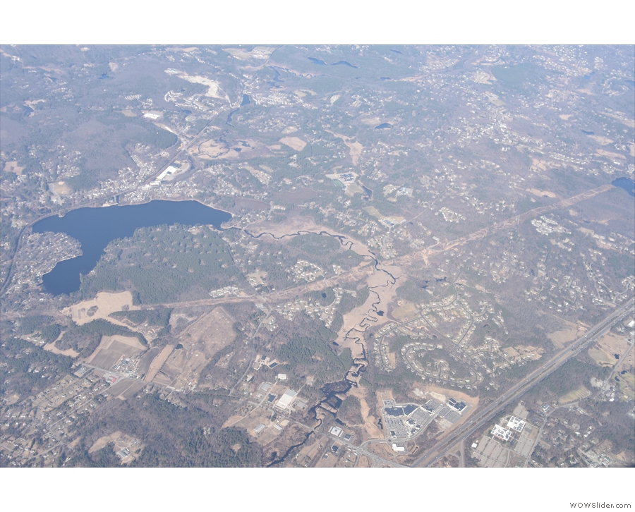Not long after, we fly past Forge Pond before...