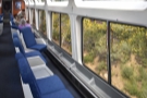 Long seats run parallel to the windows, while there are curved windows at the top.