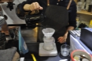 This is an example of the weight-in method, using the V60. Step one, rinse the filter paper.