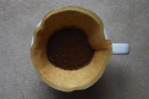 Next, grind the coffee and put it in the rinsed filter paper. Now we're ready to go.