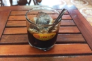... different train before retiring indoors to enjoy a a cà phê đá (black coffee over ice).