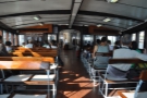 The upper deck of a Star Ferry. They can go in either direction, so the seats are reversible.