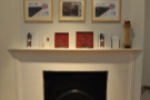 Nice fireplace at the top of the stairs with some of Colonna & Small's Awards.