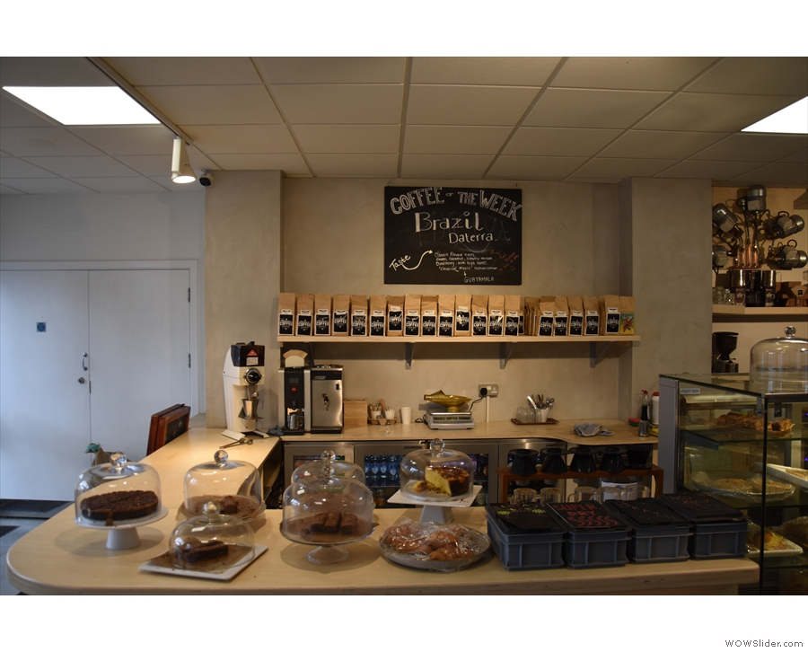 The front part of the counter has some cakes, but is mostly about the coffee.