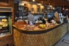 ... while the gorgeous counter is on the left, with its wood-brick construction.