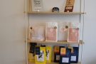 Another change is on the retail shelves opposite the counter. The Dark Woods bags are...
