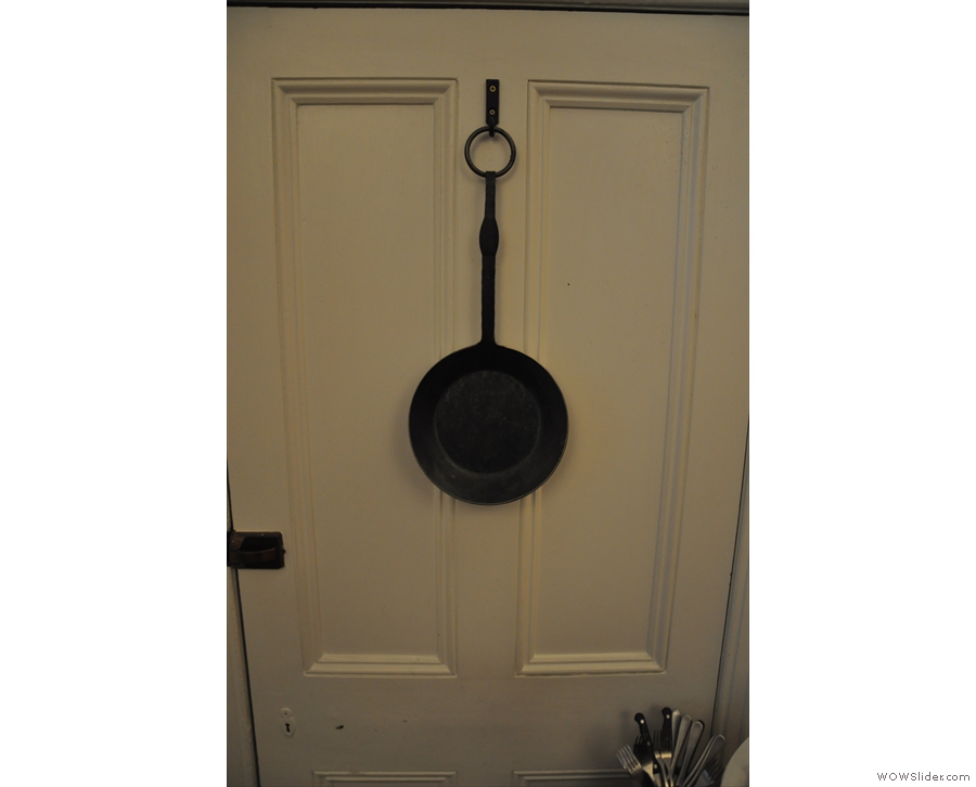 I loved the little touches, such as this pan hanging from a door...