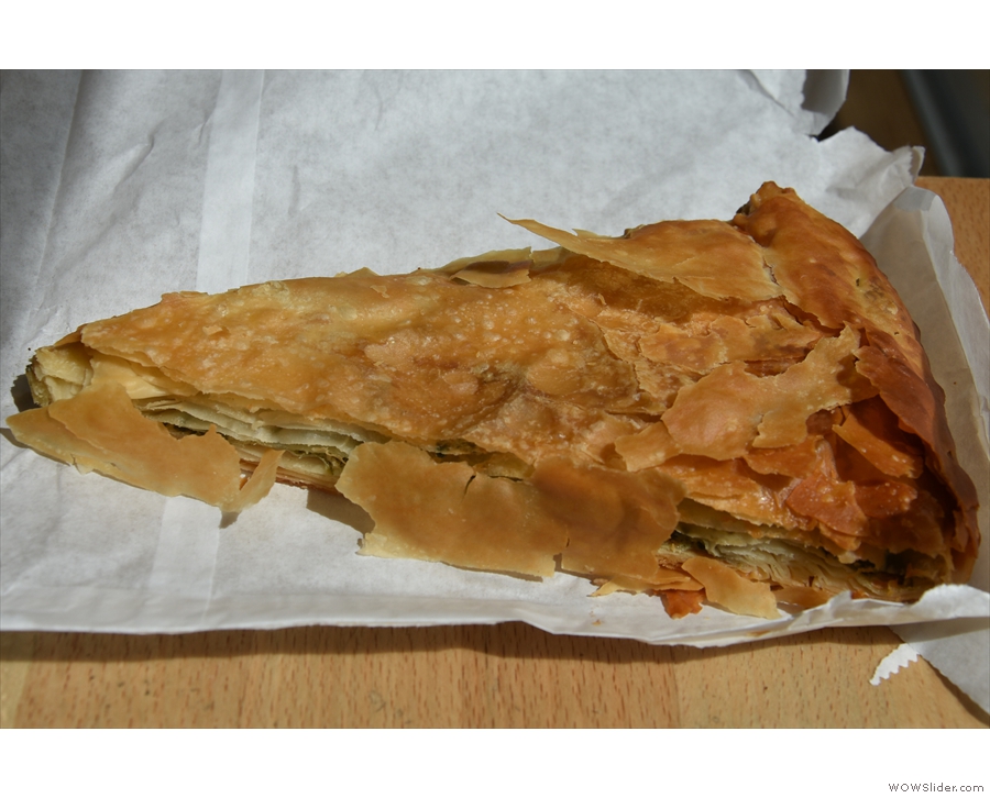 ... and a slice of spinach and feta pie for lunch, served in a paper bag.