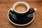Here's my espresso, in a classic black cup...