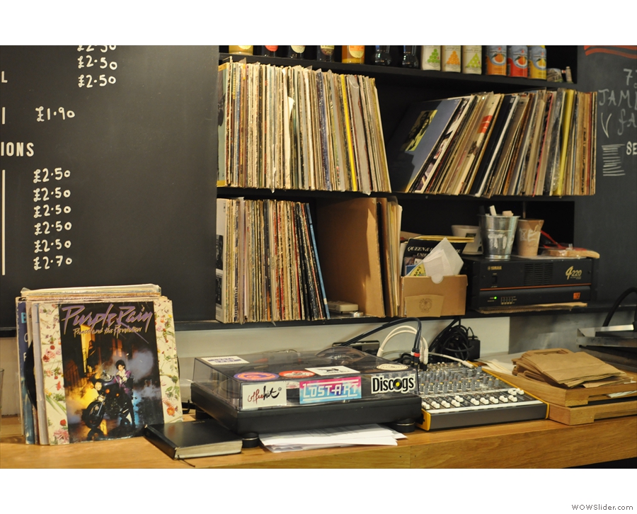 ... behind which is an old-fashioned turntable, along with a record library (from 2013).