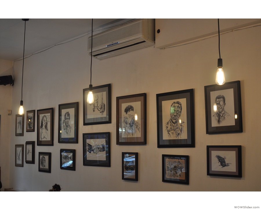 More of Ben Horton's artwork, hanging above the bench on the left as you come in.