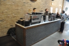 The two espresso machines have their own counter. That's the owner, Joe, on the right.