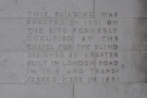 An inscription on the wall explains the building's heritage.