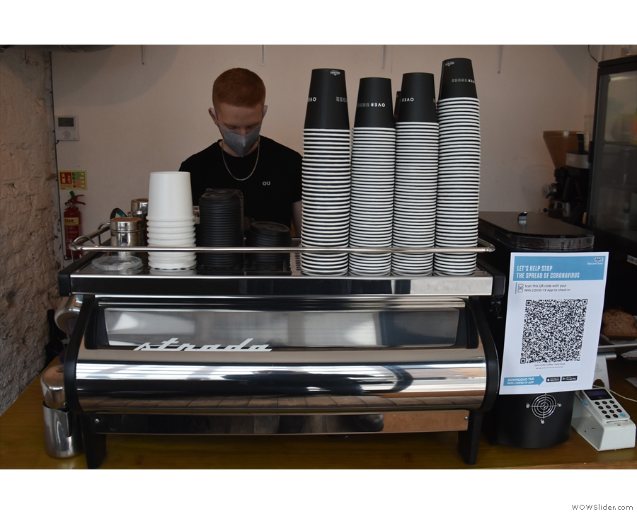 To business: one barista and his Strada espresso machine.