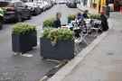 A relatively new addition is this outside seating area, occupynig a pair of parking bays.