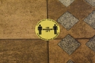 ... while the now familiar signs on the floor help you keep your distance when queuing.