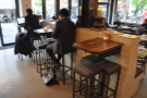 Back in 2017, there were three high tables on the dividing wall opposite the counter..