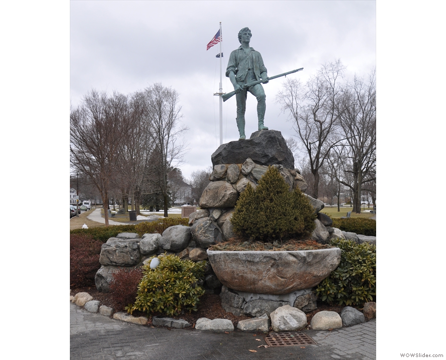 The Minuteman Statue stands across the road, with...