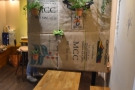 ... while the desk/till for the takeaway window is now behind this curtain of coffee sacks.