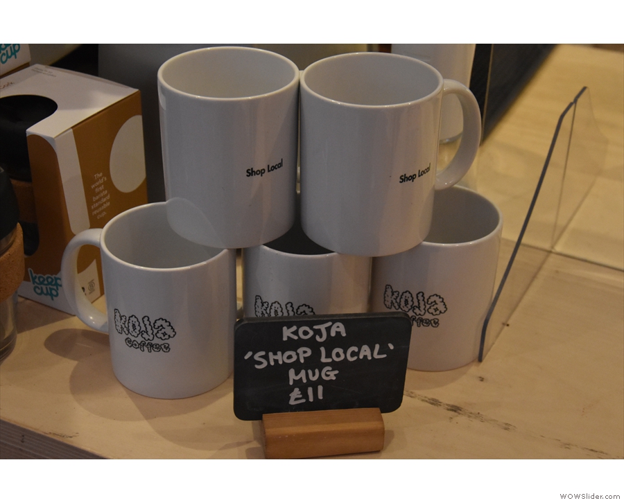 ... while to the left of the till are some branded Koja / Shop Local mugs...