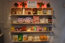 The shelves by the door are a regular mini market, with all sorts of staples...
