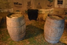 ... barrels for tables and a stove at the far end.