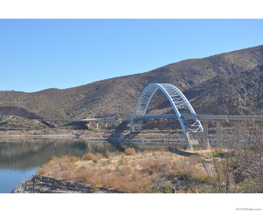 The Roosevelt Lake Bridge spans the gap where the Salt River flows into the mountains.