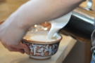 Interesting milk-pouring technique...