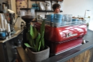 The bright-red La Marzocco and its blue cups provide a splash of colour.