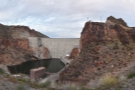 A panoramic view from the overlook, high above the water, but below the dam's rim.