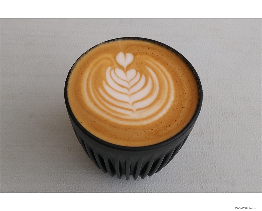 ... regular milk in my flat white, seen here in my HuskeeCup, with some awsome latte art...