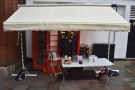 It's Lily London, tucked under this temporary awning by the Tunsgate Arch...