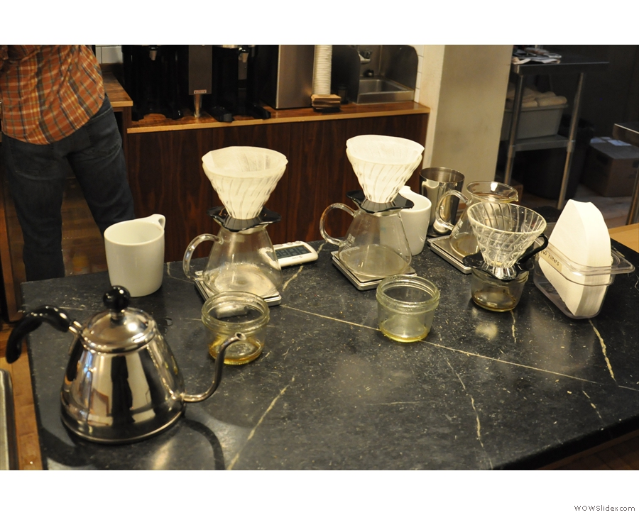 The brew bar, which is on the right-hand side of the counter, towards the back.