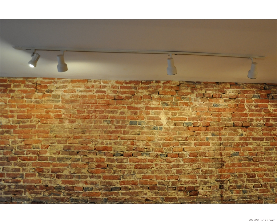 These spotlights above the exposed-brick wall in the front were particularly fine.