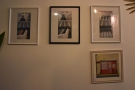 ... while the wall opposite has a display of photography from jokheirdesign.com.
