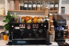 The La Marzocco espresso machine and its Mythos One grinder is at the back...